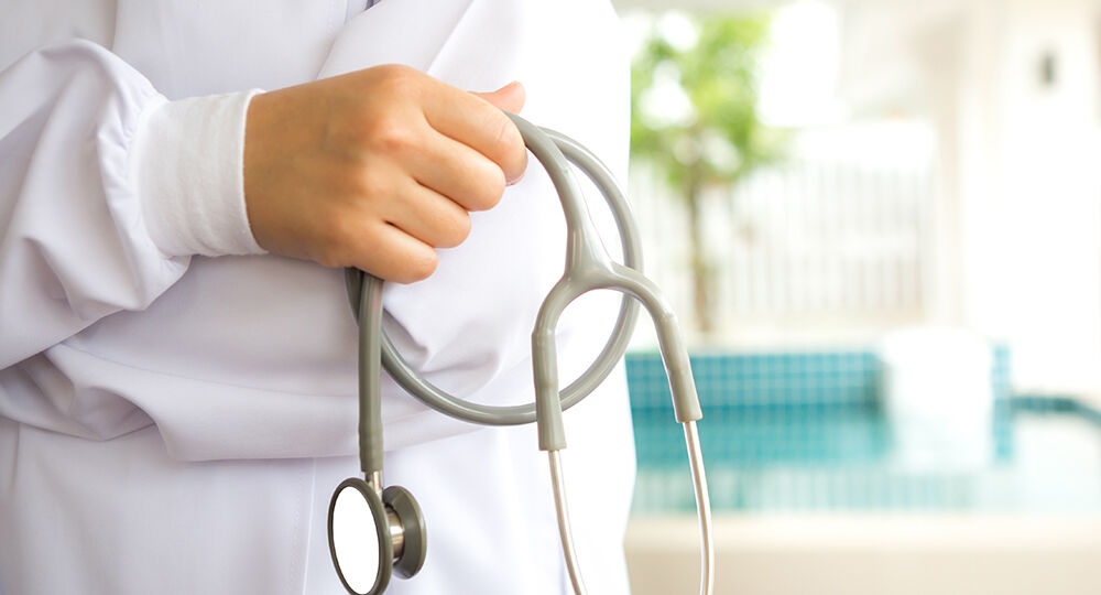 Doctor with stethoscope in the hands