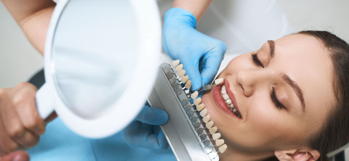 Happy woman taking care of teeth in clinic stock photo